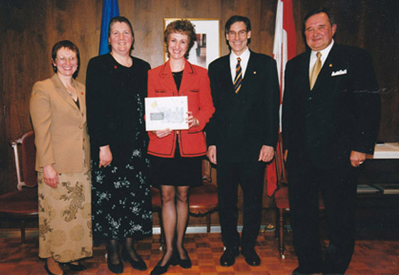Jacqueline Ryz with Lieutenant Governor of Manitoba Peter Liba, and representatives of the Red Cross